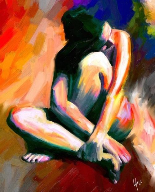 Woman Sitting And Hugging Herself